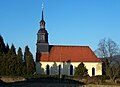 Evangelical parish church with churchyard, a tomb on the church wall and surrounding enclosure wall with churchyard gate