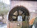 Modern welded water wheel used in the old Water mill in Sythen