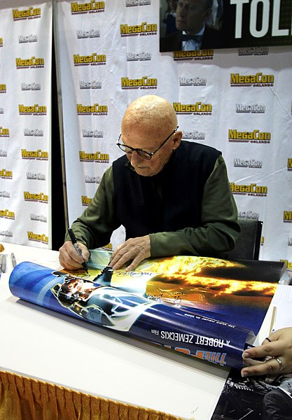 Tolkan autographing a Back to the Future poster in 2019