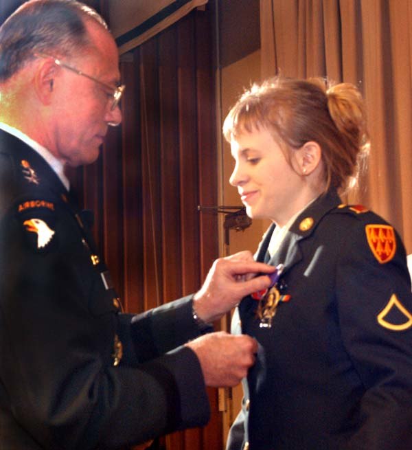 Jessica Lynch is awarded the Bronze Star, Prisoner of War, and Purple Heart medals on July 22, 2003