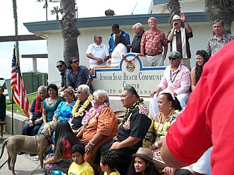 Elected officials and Seau's family surround the placard designating the Junior Seau Beach Community Center at its unveiling on July 7, 2012 Junior Seau Beach Community Center Dedication.jpg