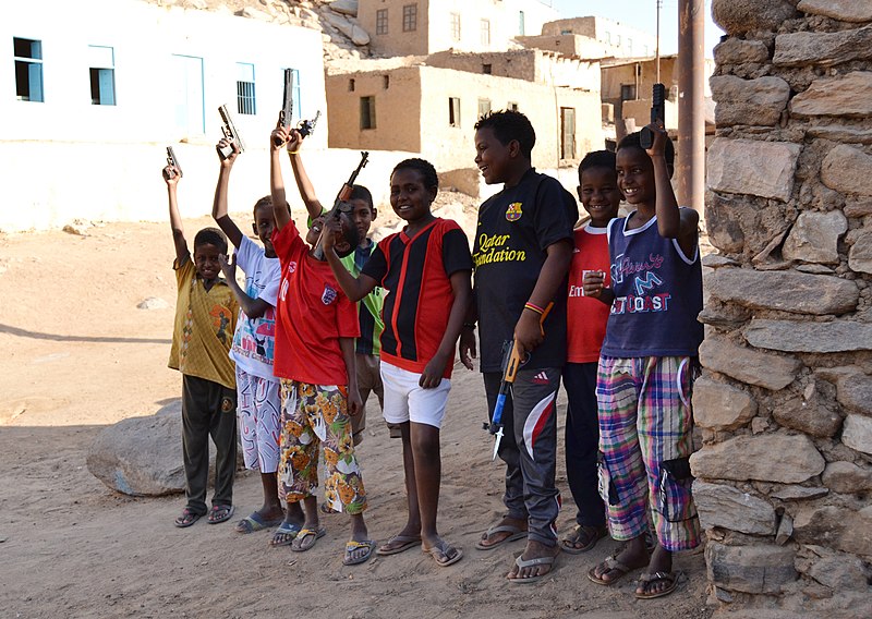 File:Kids playing with gun toys.jpg