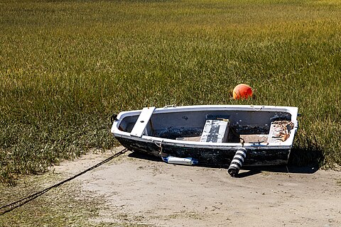 Boat (at low tide) in the marina, Knysna, Western Cape, South Africa