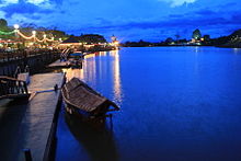 A traditional roofed wooden sampan, the main water transport in Kuching.