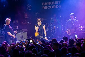 The Libertines performing in 2024 From left: Pete Doherty, Carl Barât, Gary Powell (on drums), John Hassell