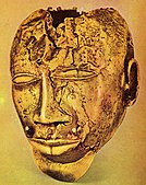 Ashanti trophy head; circa 1870; pure gold; Wallace Collection (London). This artwork represents an enemy chief killed in battle. Weighing 1.5 kg (3.3 lb), it was attached to the Asante king's state sword