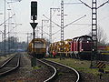 From begin to end: A DB 100, a DB 212 locomotive. Then two MFS-100, three MFS-40 and one transport waggon for machines.