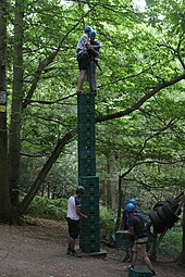 A professionally organized single stack crate climbing exercise, with the presence of protective helmets and safety harnesses Milk Crate Challenge, Blackland Farm.jpg