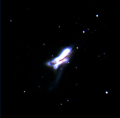 NGC 520 interacting galaxies, picture taken with the Nordic Optical Telescope using B+V+I filters. Photo by Oskari Pekkanen, Myrsky Honkela, Anniina Nurro, Aino Pursula, and Onni Tiukkanen