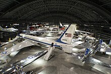 An overhead gallery view of the fourth building aircraft at the National Museum of the United States Air Force including the Boeing VC-137C SAM 26000 used as Air Force One by Kennedy, Johnson, and Nixon.