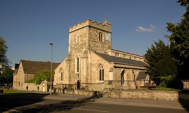 St Cross church from the south-west, with Holywell Manor behind it on the left.
