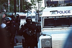 PSNI riot police in Belfast Police officers at the 2011 Belfast riots.jpg