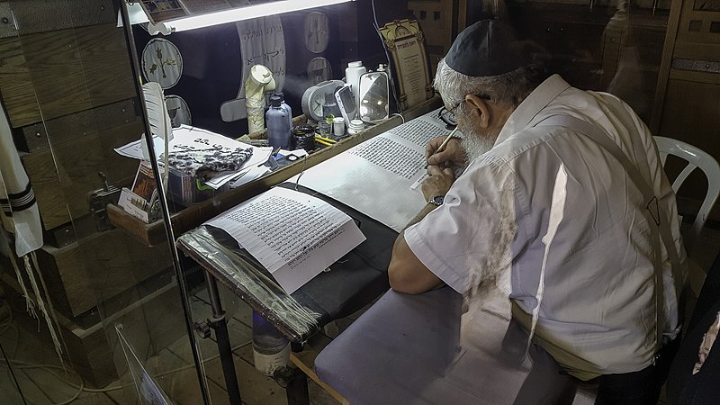 File:Rabbi writing Genesis in Hebrew.jpg