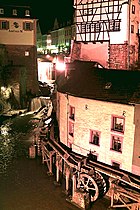 Waterfall in the center with Amüseum (former mill)