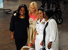 Elisabeth Hasselbeck (second from left), Sherri Shepherd and Whoopi Goldberg pose for a photograph with U.S. Navy Rear Admiral Michelle Howard during Fleet Week, New York 2010.