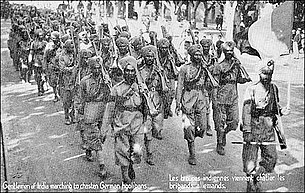 French postcard depicting the arrival of 15th Ludhiana Sikhs in France during World War I. The postcard reads, "Gentlemen of India marching to chasten the German hooligans". SikhsInFrancePostcard.jpg