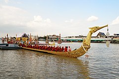 Royal Barge Suphannahong docked at Wat Arun pier, one of the Thai royal barges featured in the royal barge ceremony