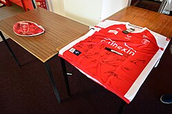 A signed Hull Kingston Rovers rugby ball and shirt at Sewell Group Craven Park, Kingston upon Hull.