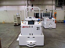 Tugger AGVs can move trailers or trains of trailers more safely than a manually operated tugger. Tugger AGV, courtesy of Egemin Automation Inc..JPG