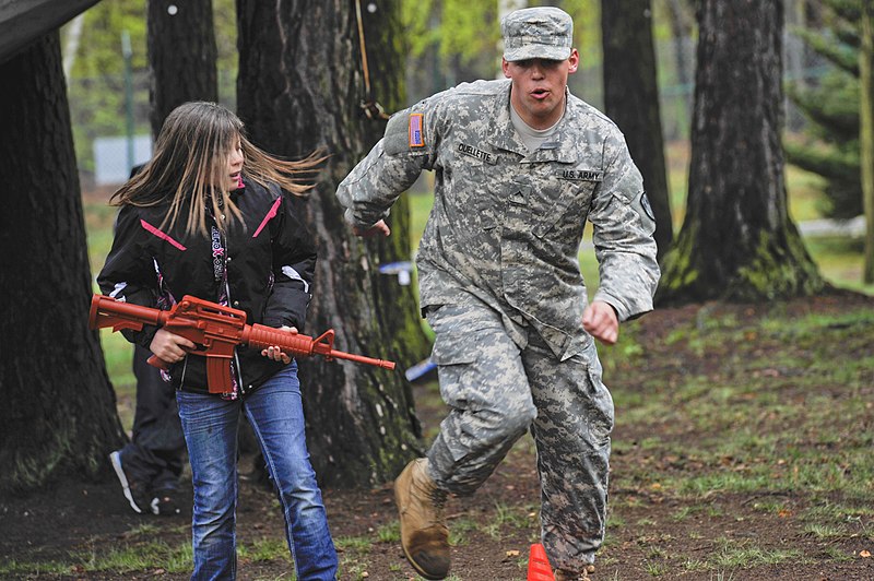 File:U.S. Army Pvt. Daniel Ovellette, right, assigned to the 230th Military Police Company, leads a girl through an obstacle course during the Month of the Military Child Fest at Pulaski Barracks, Germany, April 27 130427-F-YC884-276.jpg