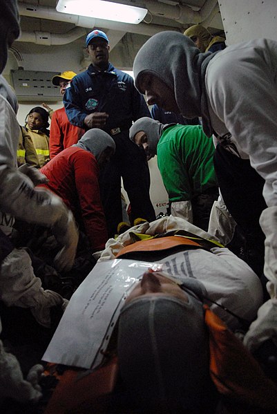 File:US Navy 090416-N-5251G-045 Medical training team member Hospital Corpsman 1st Class Nikki Craig watches over a response team as they lift a simulated electrical shock victim during a general quarters drill aboard the aircraft c.jpg