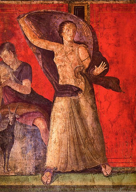 Female figure, veiled and seemingly alarmed, from a wall-painting usually described as a narrative from Dionysiac/Bacchic mystery cult, which might also involve Ariadne and a marriage. There is "almost no agreement about how it works in detail". From Pompeii's "Villa of the Mysteries"[102]