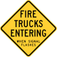 Fire trucks entering when signal flashes sign, Wisconsin.
