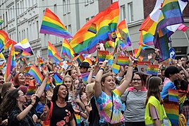 a group of people marching at Pride