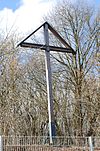 5 meter high wooden cross on the water reservoir