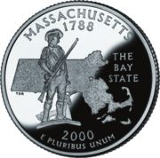 A nickle coin bearing the statue of a man in 18th-century clothing. He holds a rifle, and his coat is on a plow beside him. Behind the man is the outline of Massachusetts. Above the image is inscribed "Massachusetts" and "1788." Beside the image is inscribed "The Bay State." Below the image is inscribed "2000" and "E pluribus unum".
