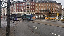 NT buses with different designs in John F. Kennedy Plads (December 2021)