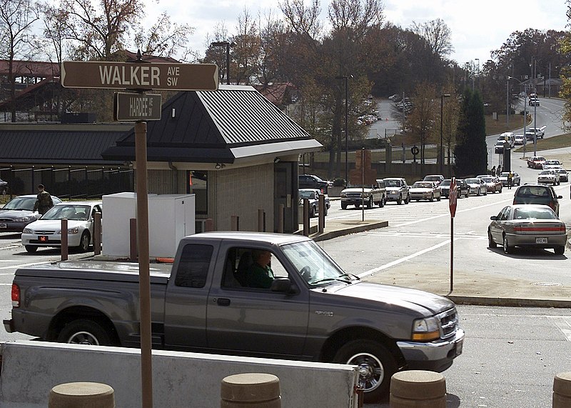 File:A line of vehicles forms at the corner of Walker Ave and Hardee Ave, South West as US Army (USA) Military Police (MP) perform a 100 percent identification check on each motorist req - DPLA - 83cb00e287bf71cf7adf084a29c661a2.jpeg