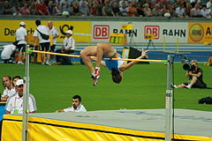 Di Martino in her winning jump during the race. Antonietta Di Martino (ITA) (3854958089).jpg