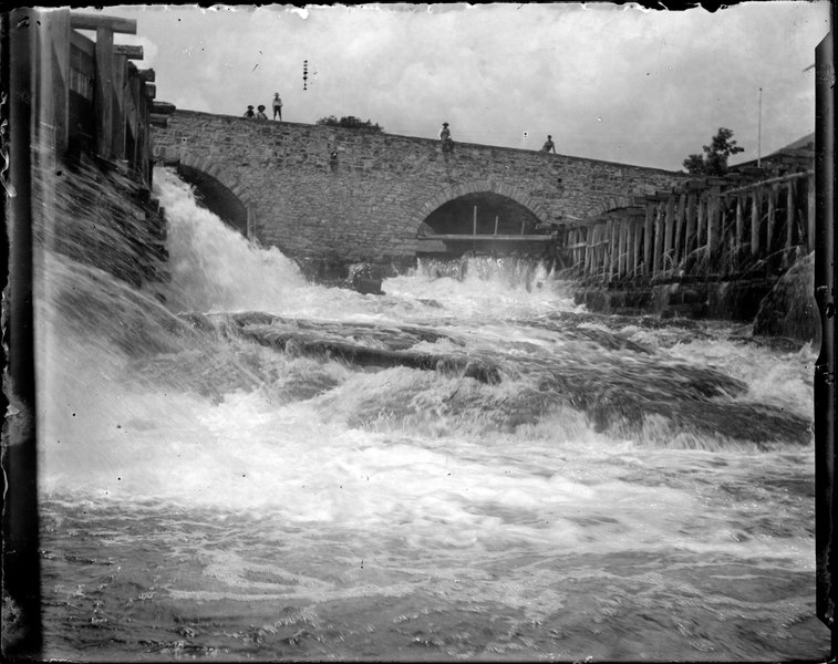 File:Boys seated along the edge of a stone bridge (I0013558).tif