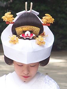 In the Shinto religion of Japan brides traditionally wear a white wedding kimono.