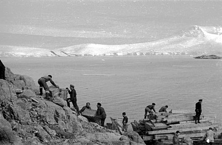 Personnel unload supplies at Port Lockroy in February 1944.
