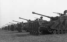 Tanks and personnel from the 12th SS Panzer Division in formation, March 1944 Bundesarchiv Bild 101I-297-1740-19A, Frankreich, SS-Division "Hitlerjugend", Panzer IV.jpg