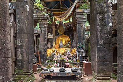 Clothed statues of the Buddha in the ruined Khmer Hindu temple of Wat Phou, Champasak, Laos