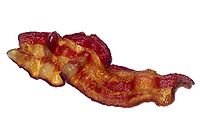 A strip of cooked bacon
