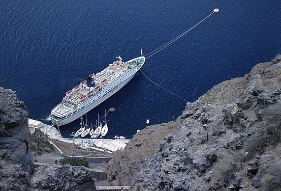 Cruise ship Apollon in old harbour of Santorini, Greece