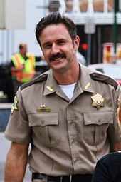 Arquette as his character Dewey Riley on the set of Scream 4. David Arquette 2010.jpg