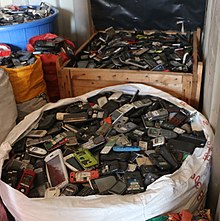 Sacks of mobile phones in Agbogbloshie, Ghana Day 6 Warehouse (25890985098) (cropped).jpg