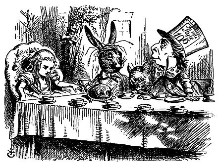 The Hatter's hat shows an example of the old pre-decimal system: the hat costs half a guinea (10 shillings and 6 pence).