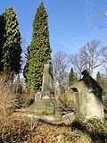 Cemetery chapel (11b), cemetery administration (11a), opposite temple-like grave complex with column portico, cemetery wall (here designation), three pans, war memorial as an obelisk for the fallen of 1866 and 1871, around which four similar stones are grouped for the Saxon, Prussian, Austrian and French dead, with the Saxon dead with an extra memorial plaque, plus some artistically valuable tombs and such important personalities, including the mayor Gottlob Ludwig Demiani, who died in 1846, as the first buried here in 1847 (individual monument to ID no. 09282986)