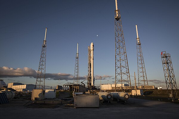 SLC-40 with SpaceX Falcon 9 launch infrastructure. The four towers surrounding the rocket are lightning arresters, and acts like a giant Faraday cage