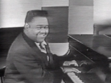 Hitmaker Fats Domino in 1956 Fats Domino 1956.png