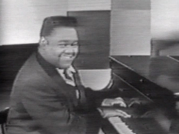 A screenshot of Fats Domino singing "Blue...