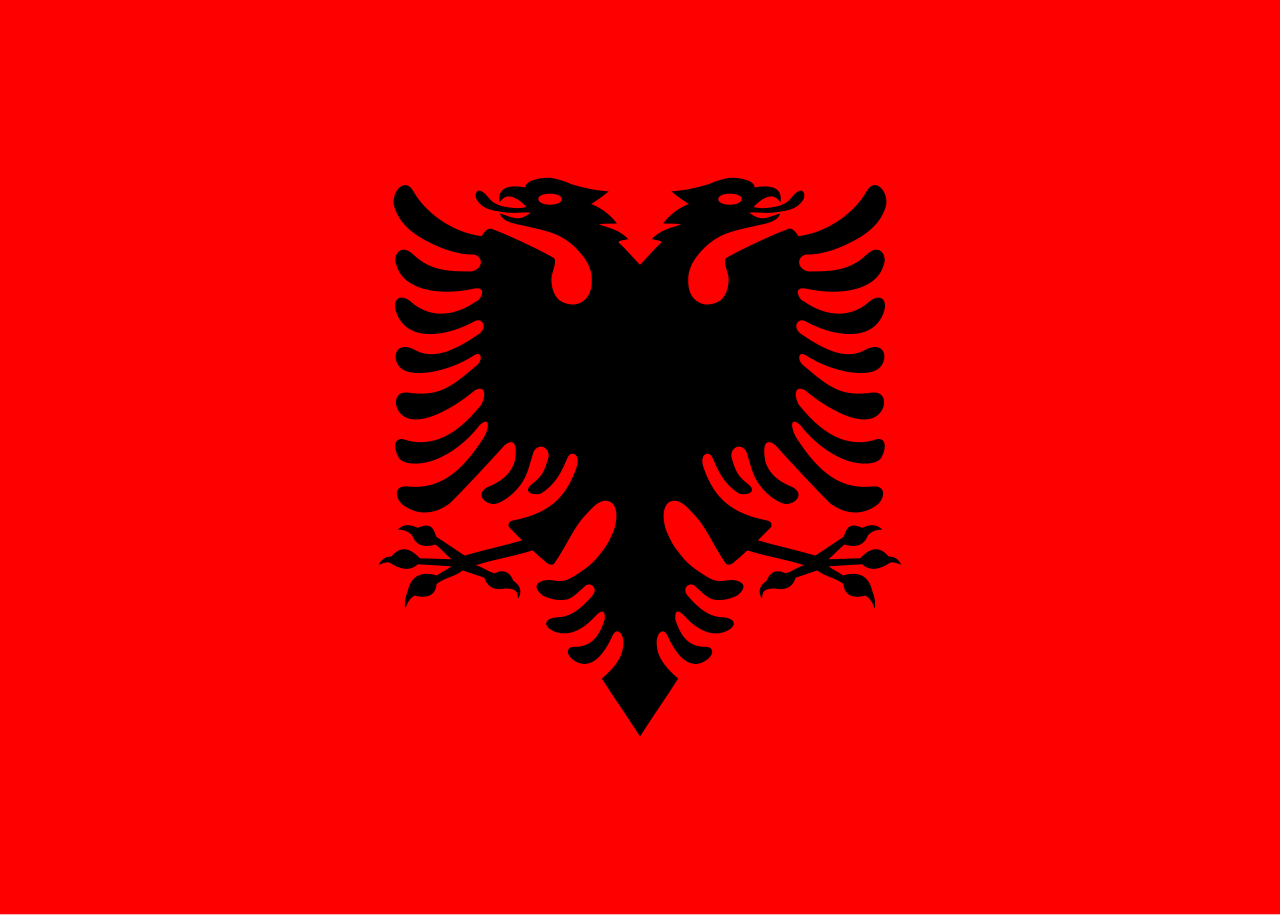 Red flag with a black double-headed eagle in the center.