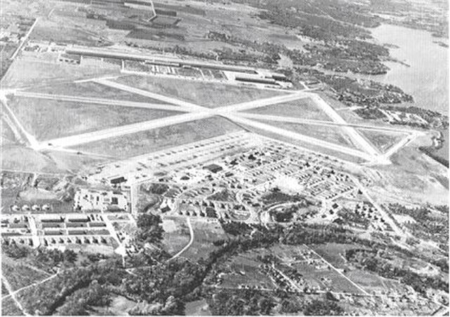 Oblique airphoto of Fort Worth Army Air Field in 1945, looking east to west. The airfield technical area is on the east side of the main north–south r