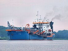 The Geopotes 14 lifting its boom on a canal in The Netherlands. (geopotes is Greek for "that which drinks earth") Geopotes 14.jpg